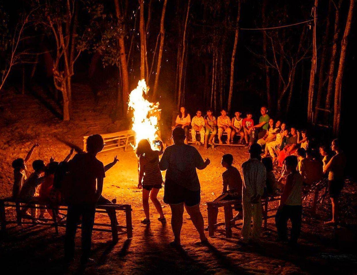 Sit at a bonfire session around your tents