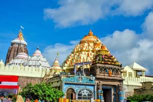 Observe idols adorned with vibrant ritual attire daily