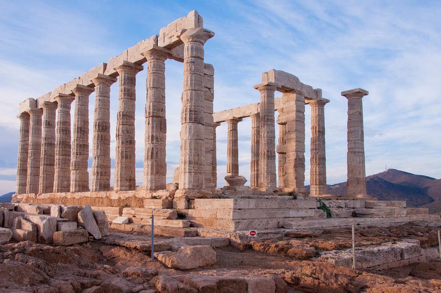 Travelers and archaeologists at Sounion