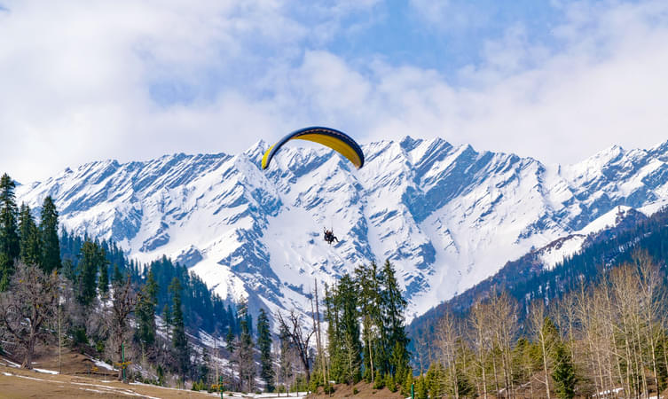 Feel the wind rush through your hair as you paraglide over Solang Valley