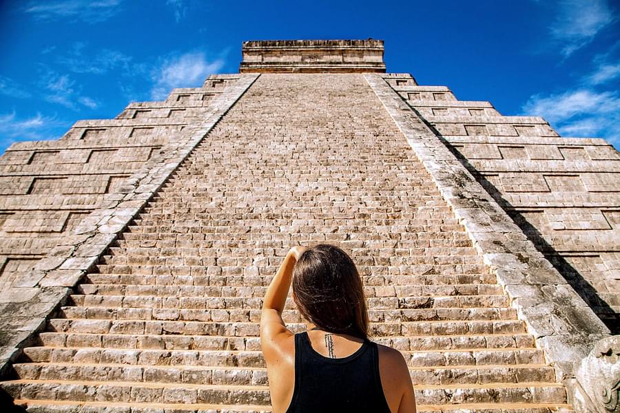 Marvel at the massive step of the pyramid i.e. Temple of Kukulcan