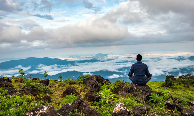 Tourist enjoying scenic view in Coorg