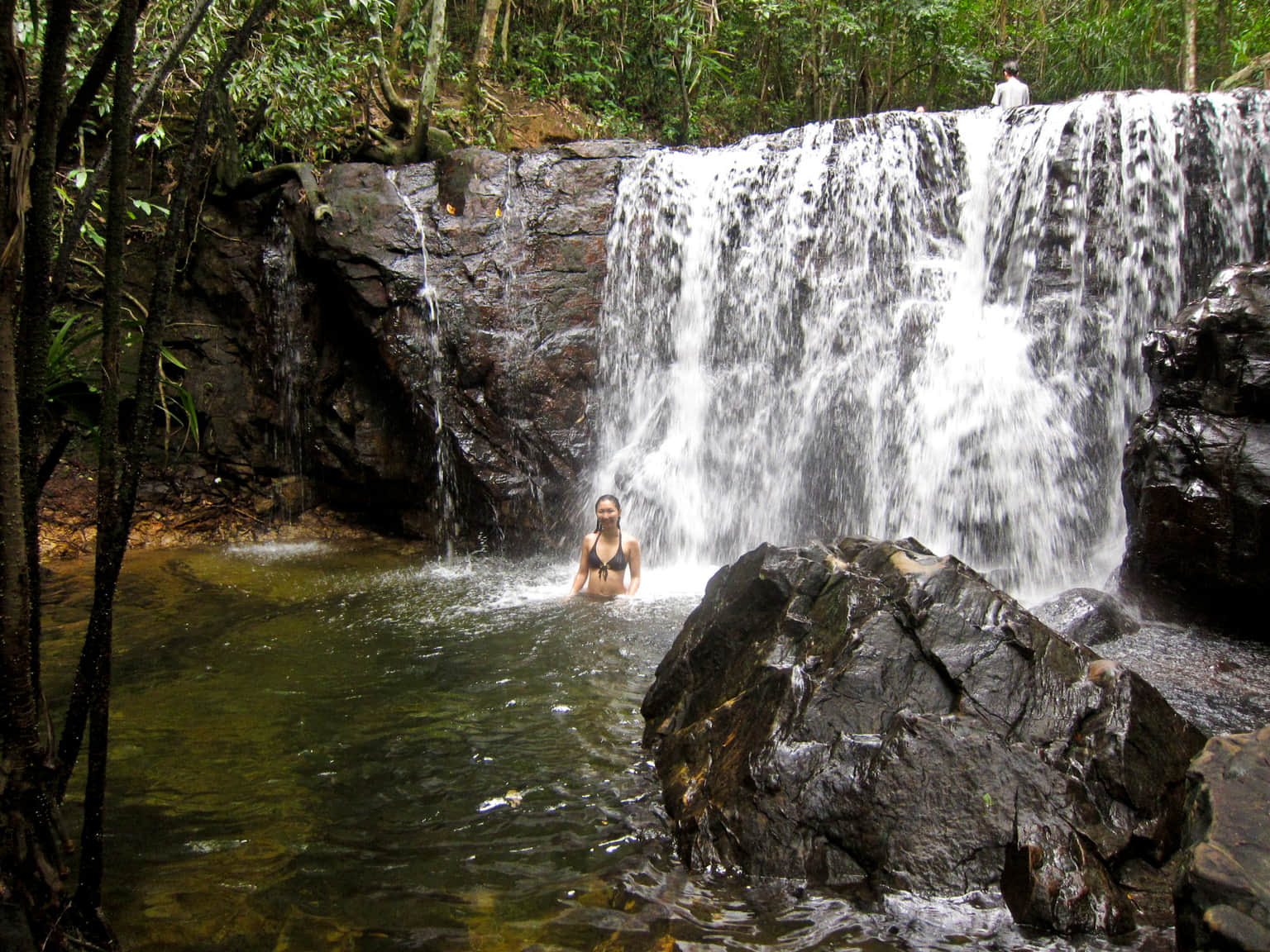 Enjoy a swim under the waterfall