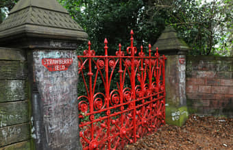 Iconic Red Gate of Strawberry Field in Liverpool