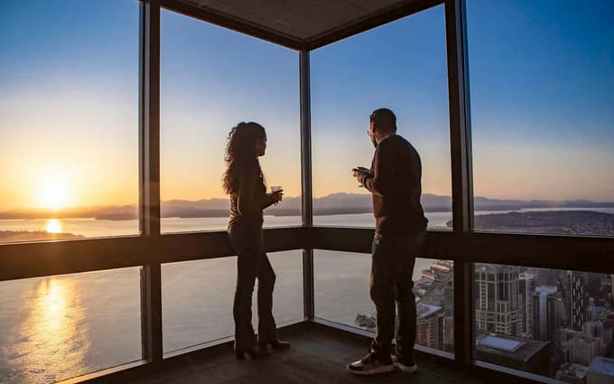 Travelers admiring the stunning skyline views from the Sky View Observation Deck