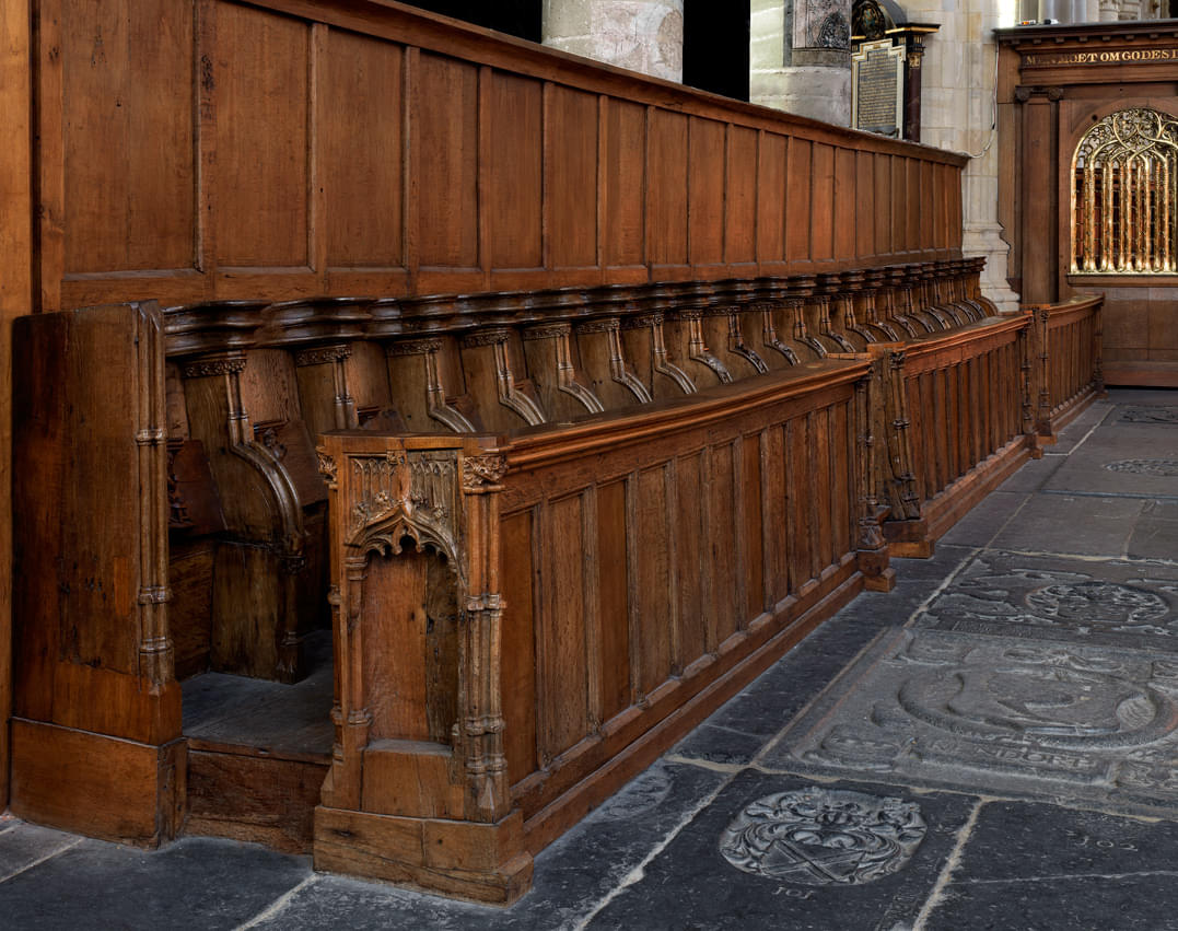 Marvel at the late Gothic style special wooden choir stalls 