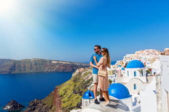 Tourist enjoying the beautiful Santorini Island View, Greece