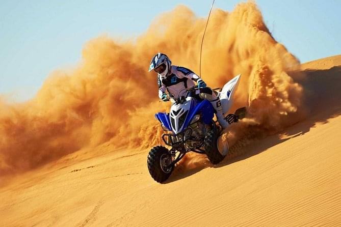 Drifting through the dunes and create a sand storm of your own with your quad bike