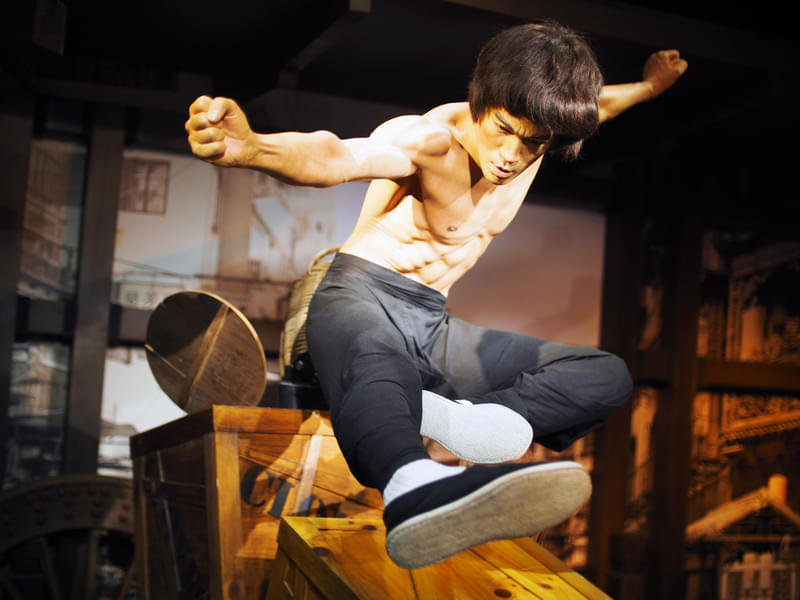 Capture photos with Bruce Lee in an action pose