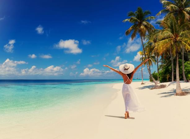 Tourist strolling on the serene coastline