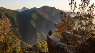 Sit atop the iconic Dolphin’s Nose rock formation and admire the panoramic views of the lush valleys and distant mountains