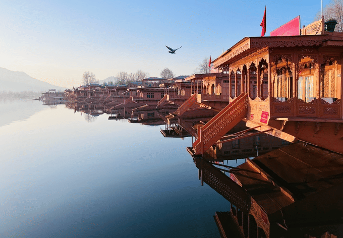 Relax on a traditional houseboat surrounded by serene Dal Lake waters