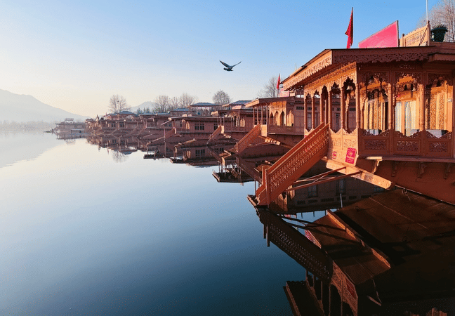 Relax on a traditional houseboat surrounded by serene Dal Lake waters