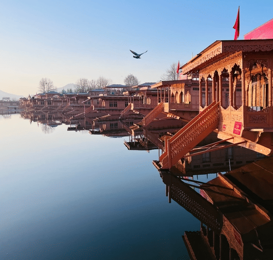 Relax on a traditional houseboat surrounded by serene Dal Lake waters
