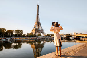 Stroll along the Seine River and admire the Eiffel Tower rising gracefully against the Parisian sky