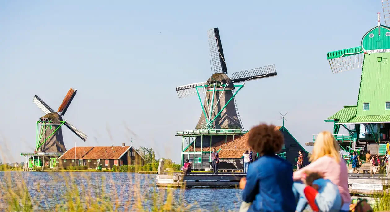 Get clicked with colorful windmills in the background