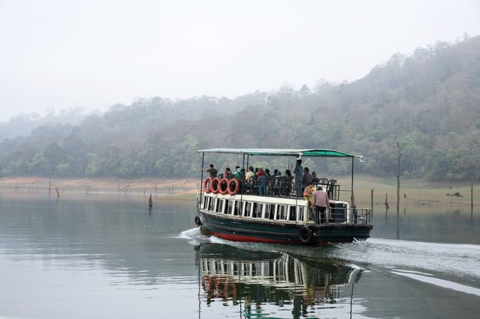 Experience the thrill of a 1.5-hour boat safari on Periyar Lake, passing through the serene waters and lush landscape