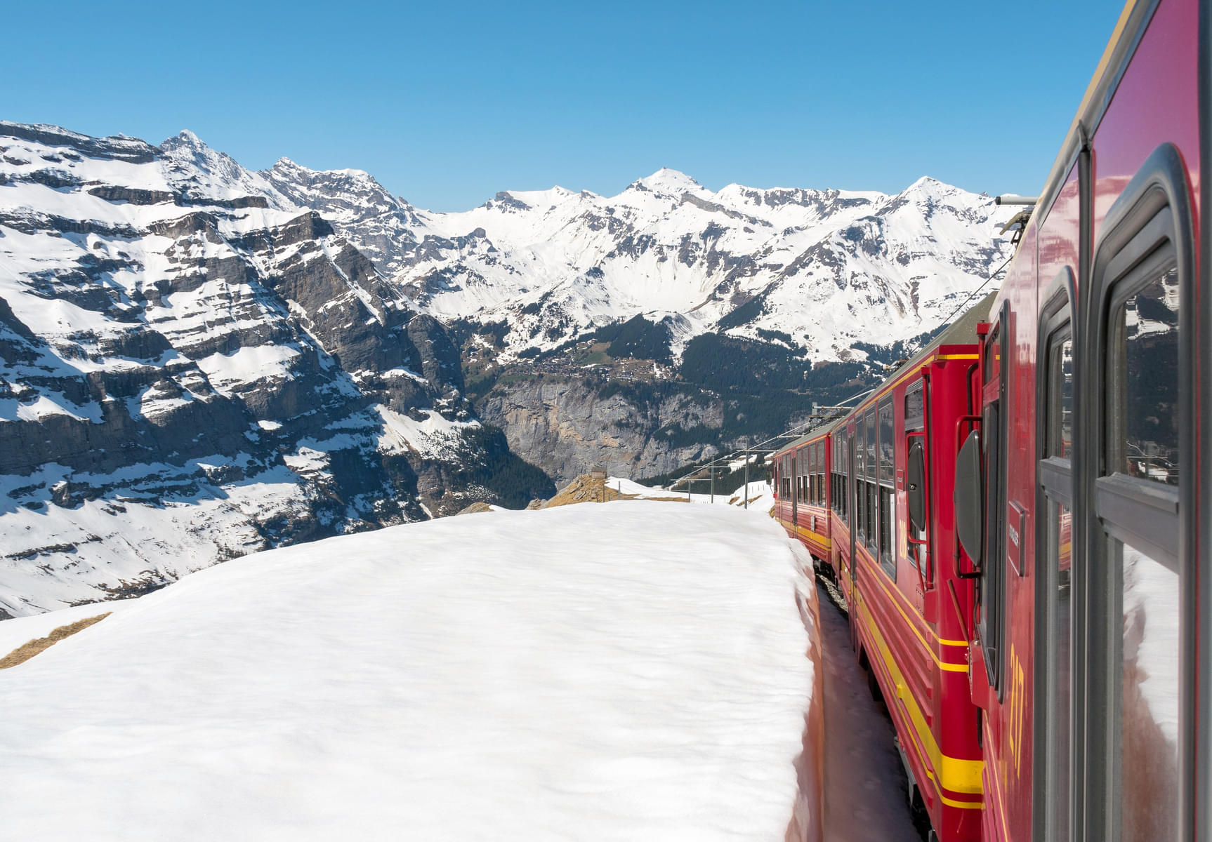 See the scenic vistas of majestic mountains during the cogwheel train journey