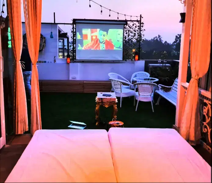 Rooftop Candlelight Dinner and Private Movie Experience for Couples, New Delhi Image