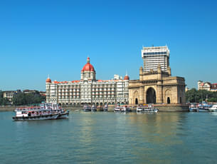 Take a look at the iconic Gateway of India & Taj Hotel while bording the ferry