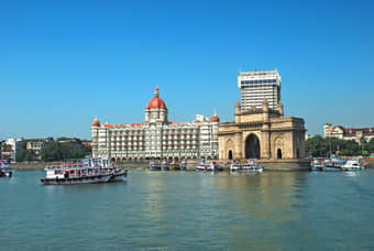 Take a look at the iconic Gateway of India & Taj Hotel while bording the ferry