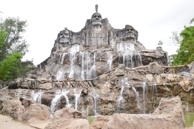 Admire the breathtaking cascade of water as it plunges into the serene surrounding