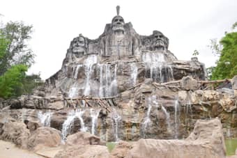 Admire the breathtaking cascade of water as it plunges into the serene surrounding