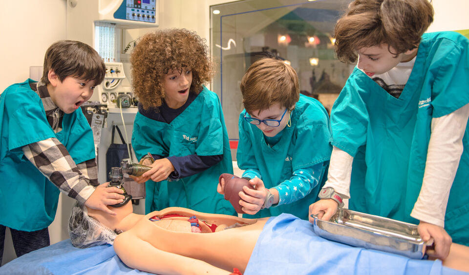 Kids perform surgery on a dummy human and have fun