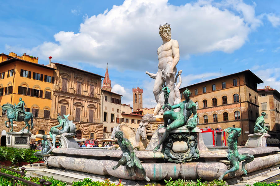 Marvel at the intricately carved Fountain of Neptune