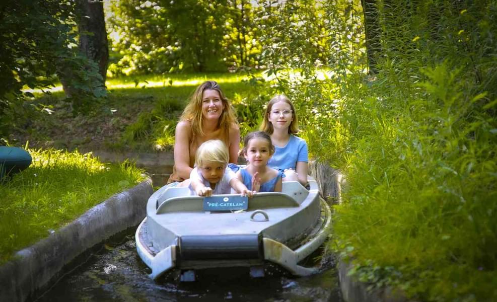Enjoy a boat ride through the lush green gardens