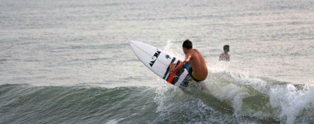 Surf Through Thrilling Waves In Pondicherry Image