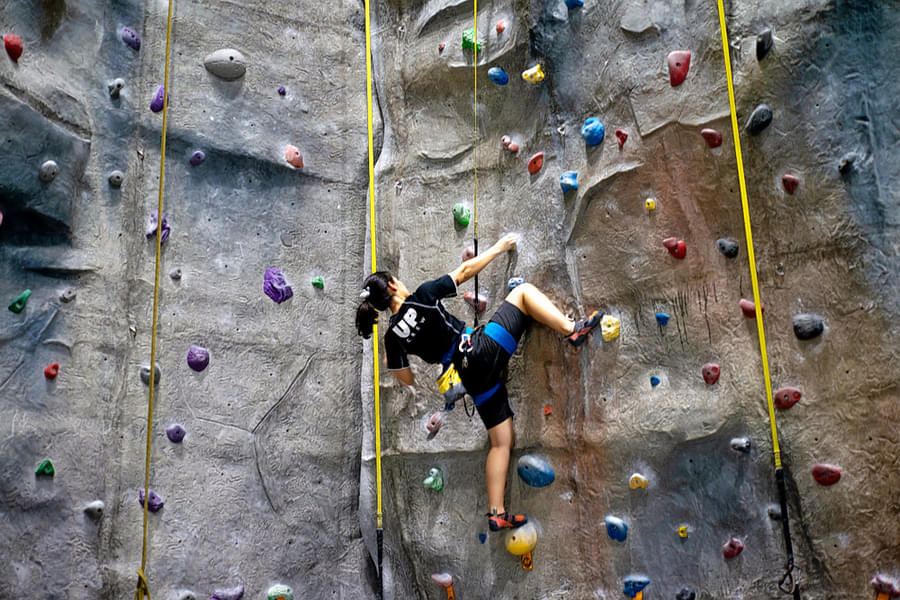Experience the thrill of climbing on a real mountain with high-tech walls inside the facility