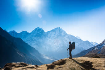 Trekker enjoying the view from summit