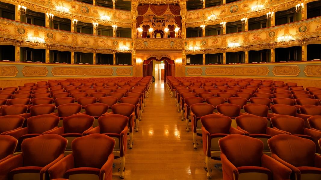 Step into the historic elegance of Teatro La Fenice and experience the beauty of Venice's cultural heritage.