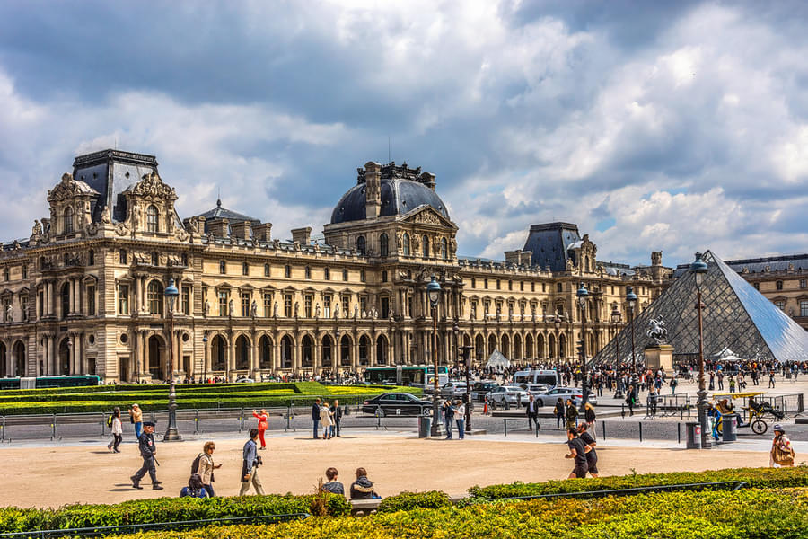 Visit Louvre Museum that is a historic landmark in Paris