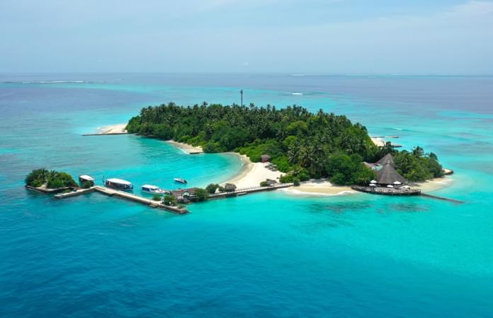 Stay in a beachfront bungalow, steps away from the turquoise lagoon