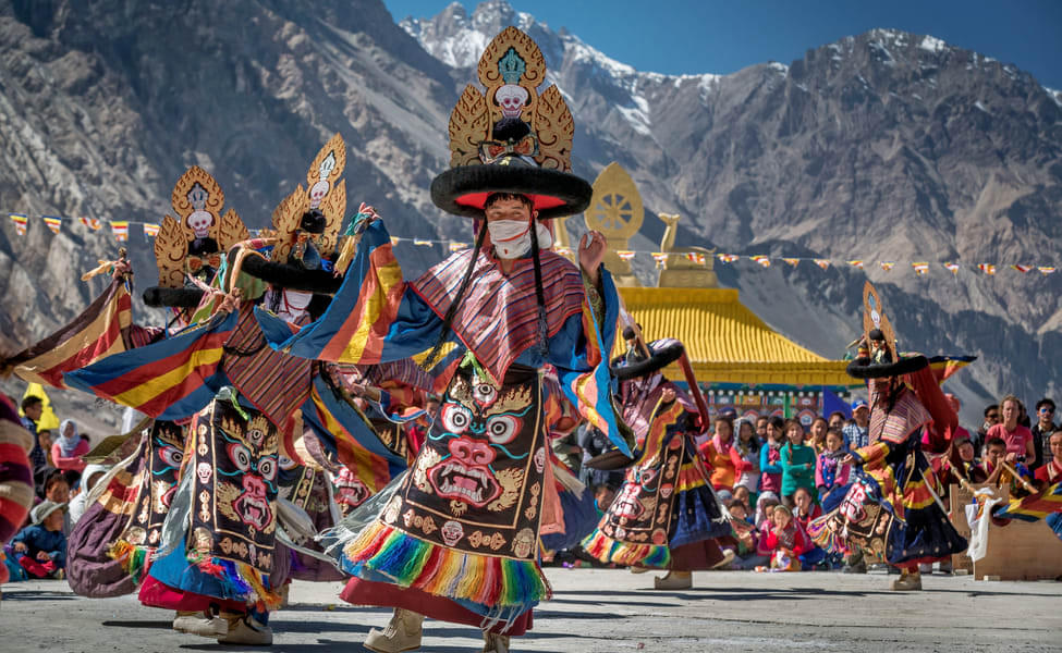 Adore the vibrant Cham dance performances of the locals of Ladakh