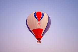 Unwind above the dunes with golden skies and gentle breezes