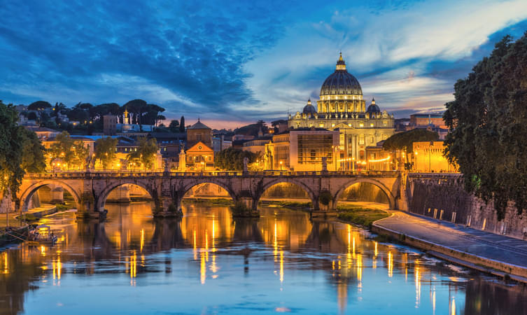 Admire the picturesque view of River Tiber flowing through the heart of Rome