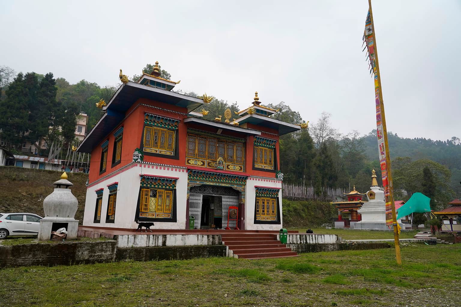 Admire the Norbugang Coronation Throne & Chorten