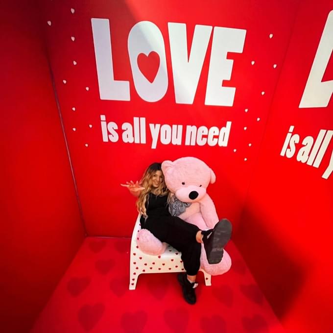 Girl taking pictures with the teddy