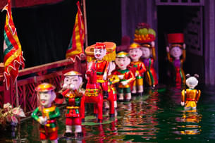 Watch the traditional puppet show at the Golden Dragon Water Puppet theater