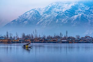 Soak in the beautiful view of Dal Lake and its iconic houseboats