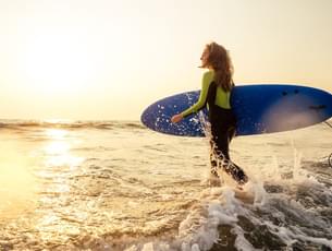 Surfing at Kuta Beach, Bali