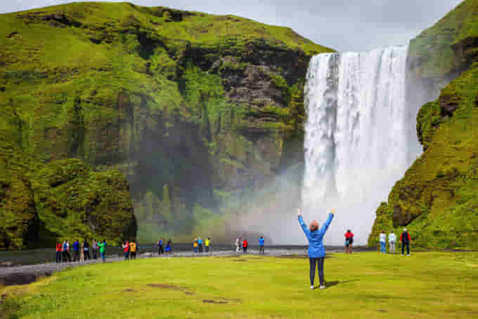 Tourist at Skogafoss Waterfall