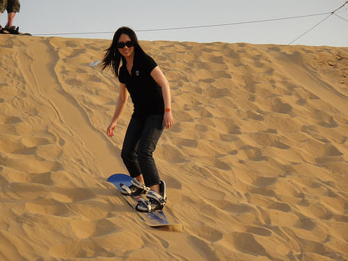 Hit the dunes with the sandboard. 