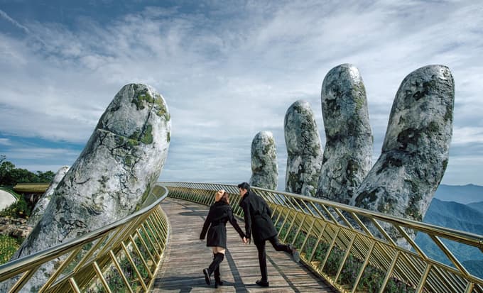 Couple posing at Golden Hand Bridge