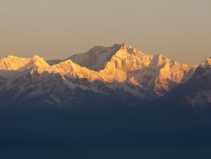 Watch the snow-capped peaks of Mt. Kanchenjunga from the Tiger Hills