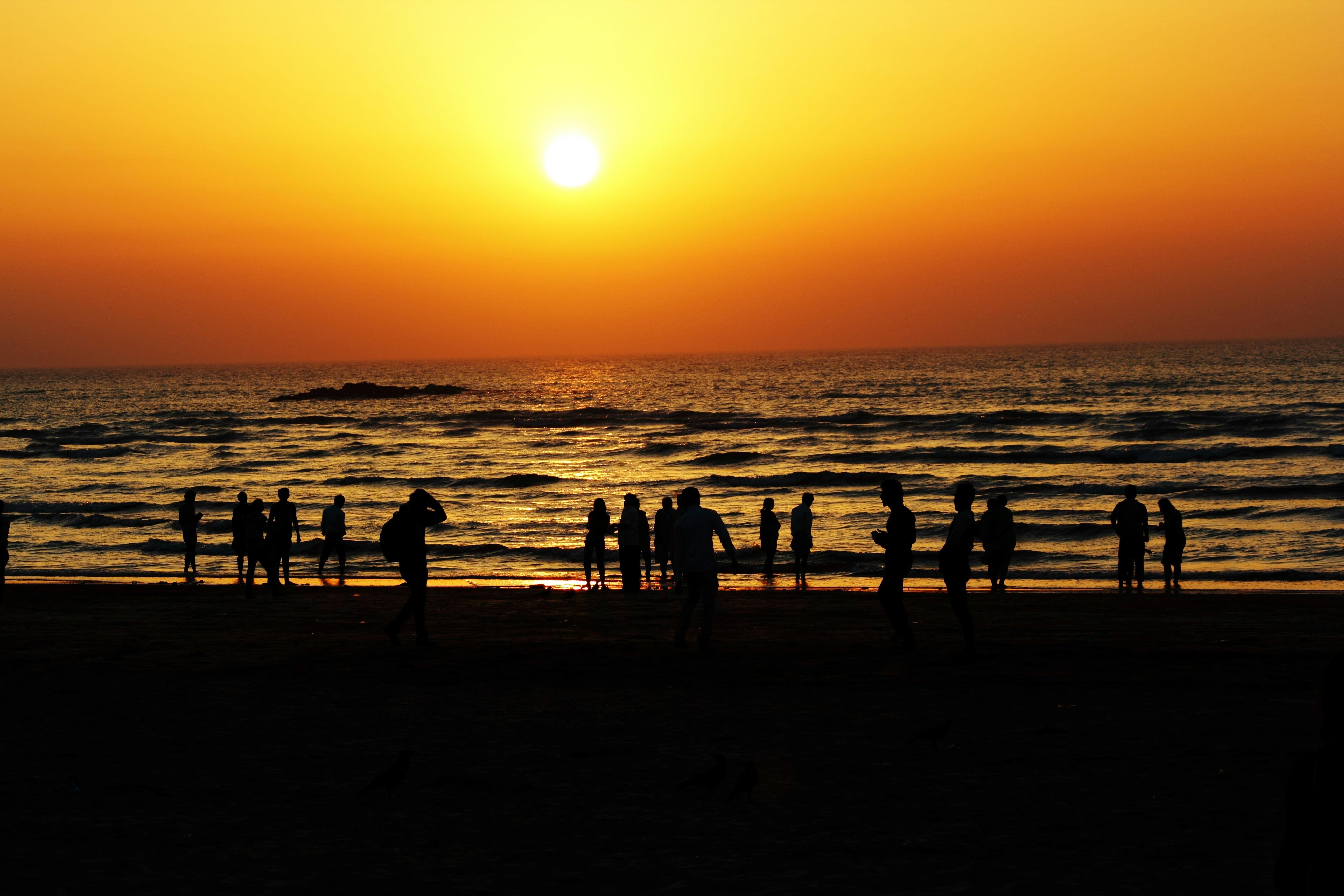 Watch a golden sunset over calm waters