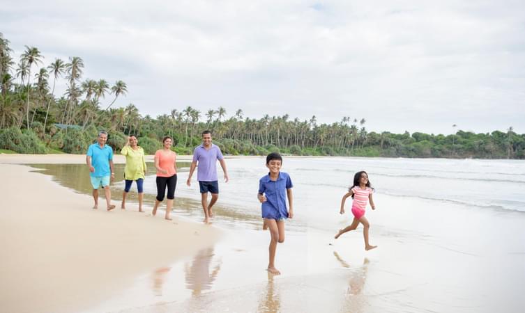 Family enjoying at beach in Kerala